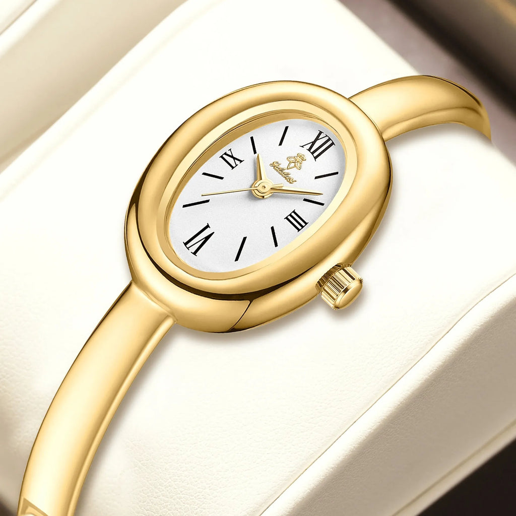 Women's oval retro quartz watch with 8mm thickness showing gold and silver colour options with spiral patterns
